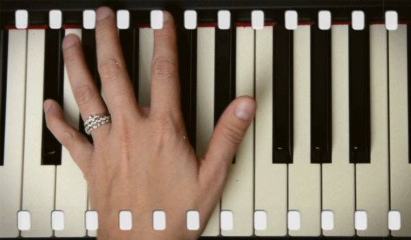 Buy one get one stacking bands being worn while playing piano