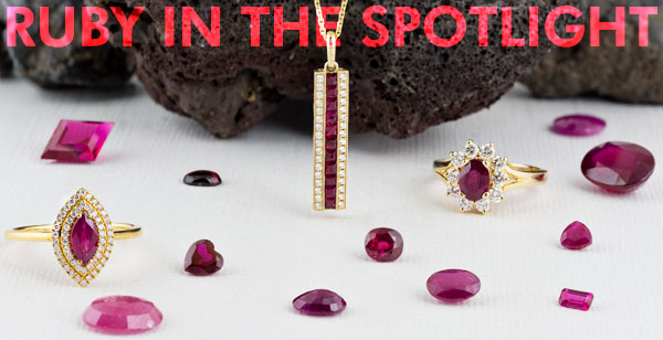 A collection of loose ruby gems and ruby jewelry