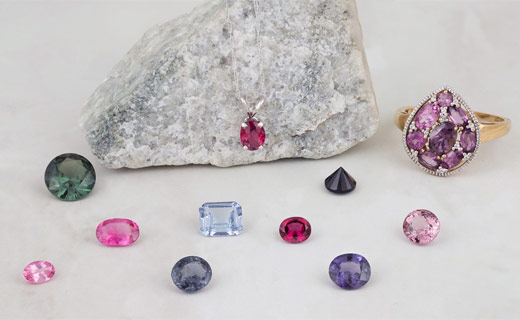A group of loose and set spinel gems