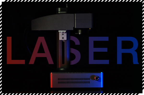 A dark image of our laser engraver with blue and red lights