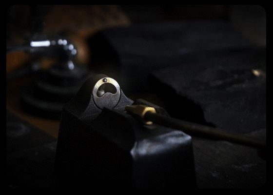 An looped animation of a jewelers torch lighting