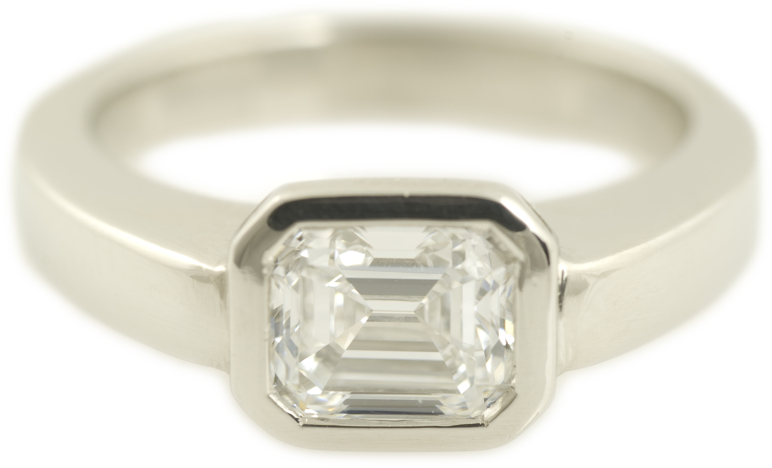 Modern Bezel Set Emerald Cut Diamond Engagement Ring