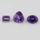 Group of loose amethyst gems emerald cut trillion and oval