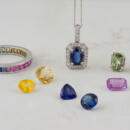 Collection of sapphire jewelry and loose sapphire gemstones in many colors