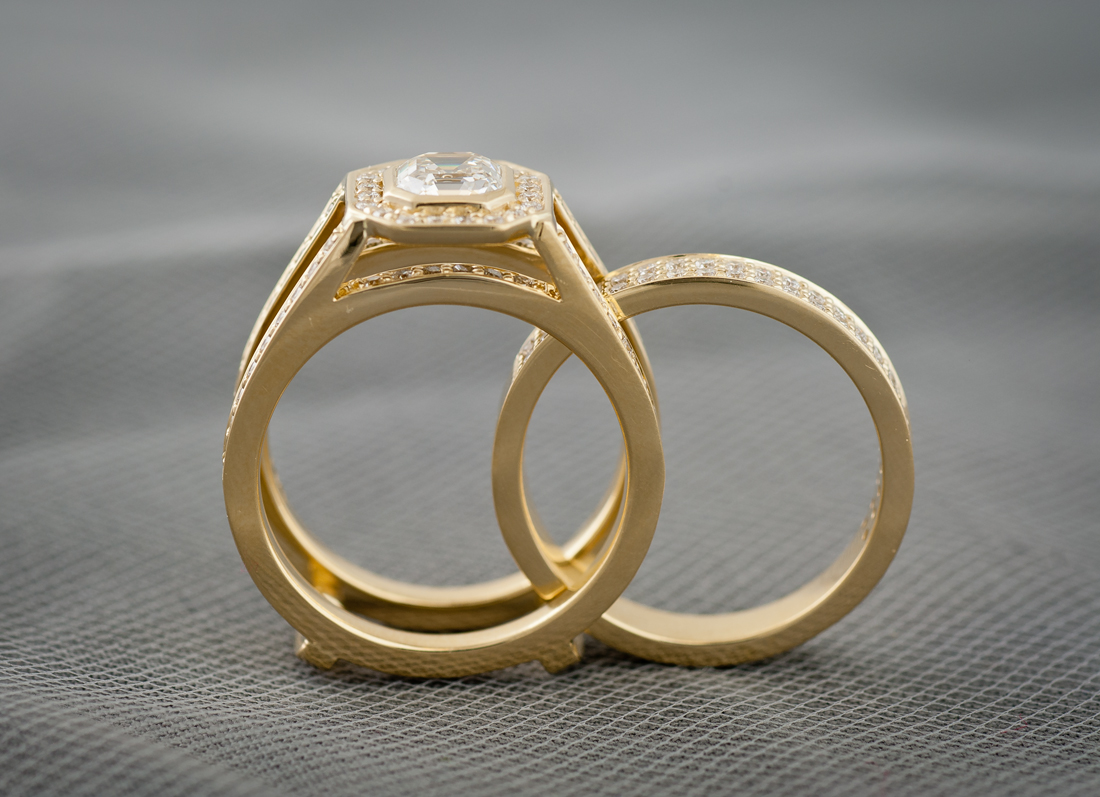 Custom wedding set with bezel set asscher cut center diamond through set