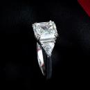 Asscher cut engagement ring with triangel accents - side