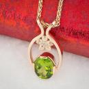 Oval peridot mothers pendant - angled