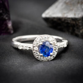 Non-traditional sapphire halo engagement ring