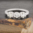 Small three stone diamond band