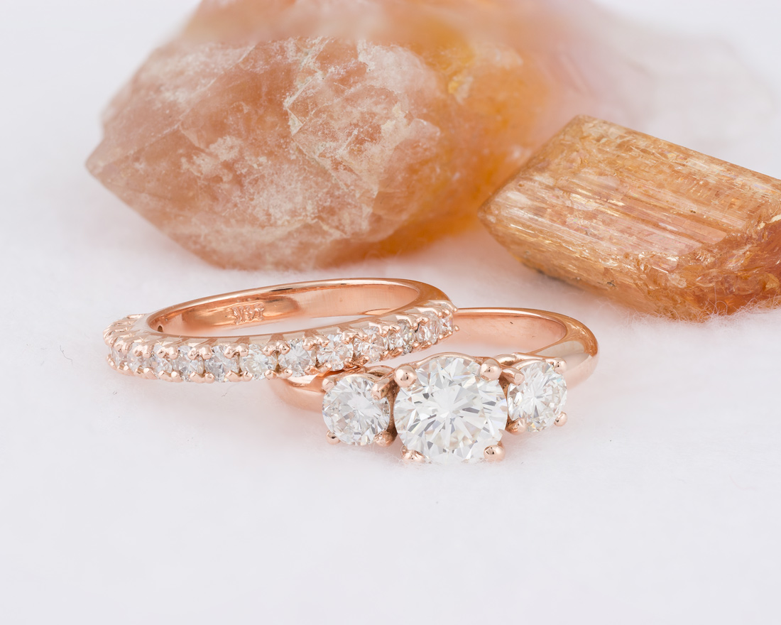 Rose gold three stone ring with diamond band