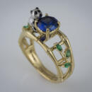 edge of ring showing emeralds and sapphire