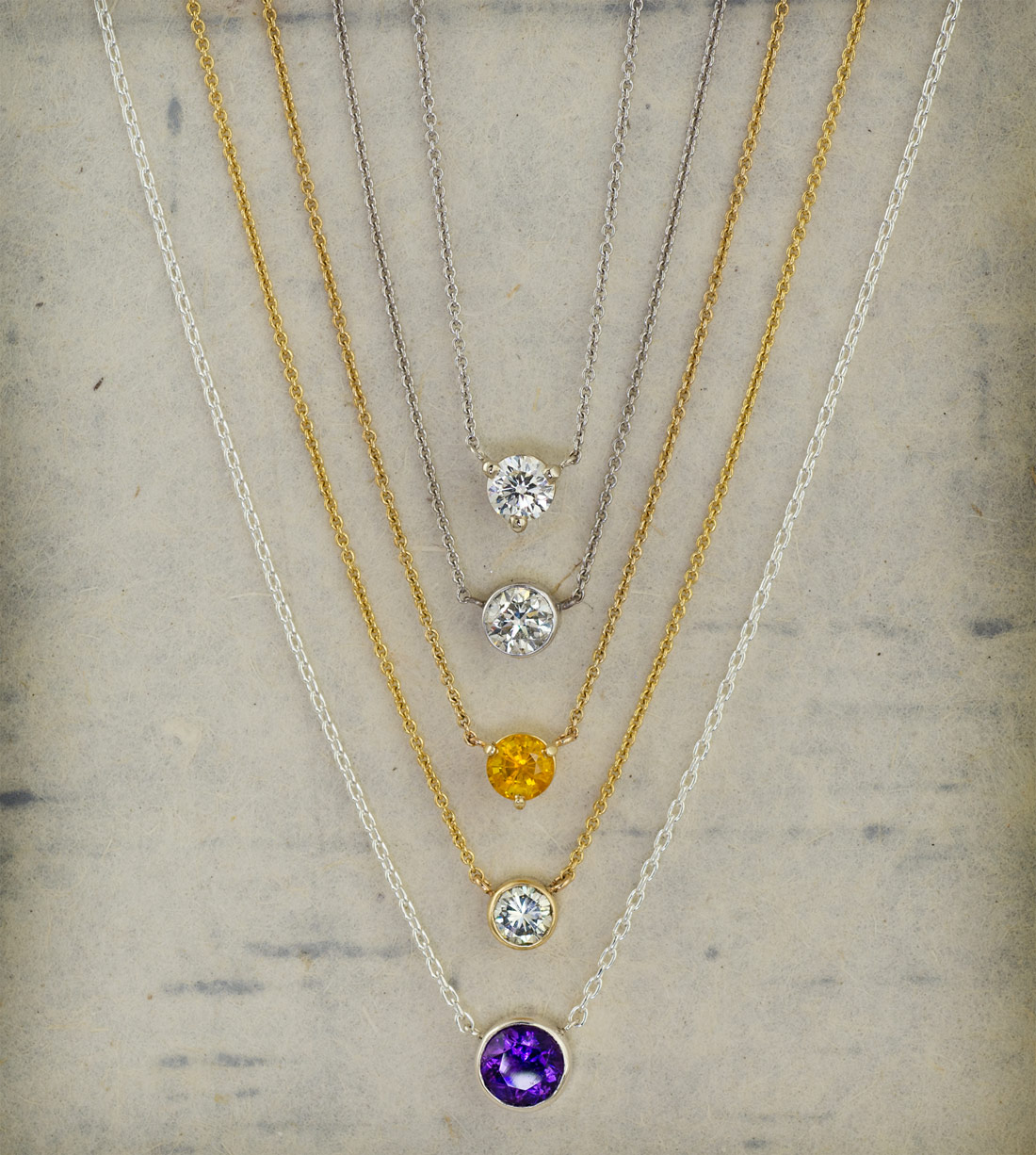 Floating diamond solitaire pendants