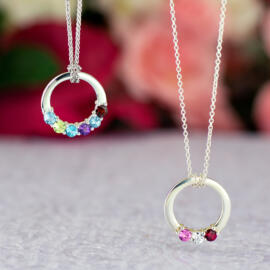 Two white circle Mothers Day pendants with gemstones