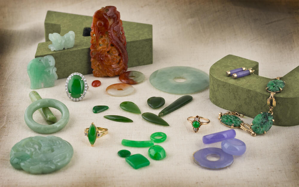 A collection of jade jewelry and loose gems
