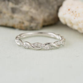 front angle white gold twisted diamond band on fancy background