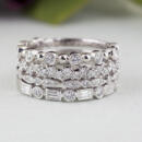 Group of stackable rings with four different white gold diamond bands