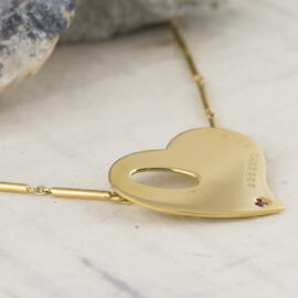 fancy background roberto coin heart necklace side left view