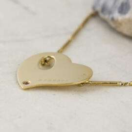 fancy background roberto coin heart necklace side right view