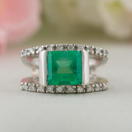 fancy background square emerald split shank front view