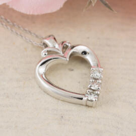 front angle fancy background three diamond heart necklace