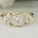 round halo graduating diamond engagement ring front