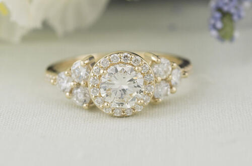 round halo graduating diamond engagement ring front