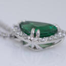 trillion emerald and diamond halo necklace side