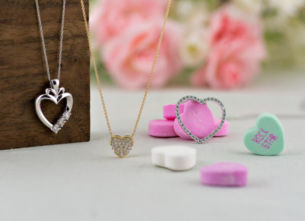 Group of heart shaped pendants with flowers and Valentines Day candy