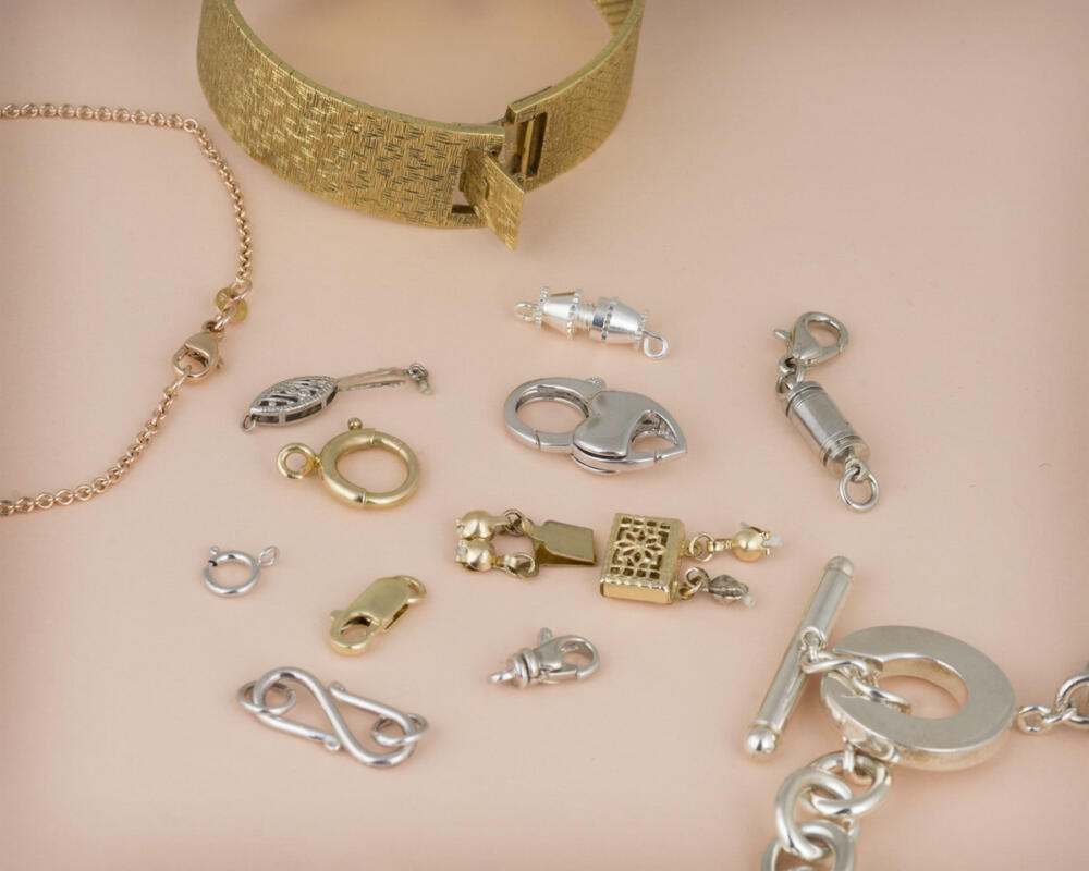 Collection of many different styles of jewelry clasps laid out together