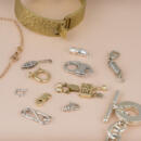 Collection of many different styles of jewelry clasps laid out together