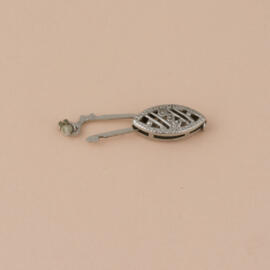 Single fishhook style pearl clasp open showing safety feature