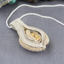 side view bold wire wrapped gold quartz necklace in silver and 22k