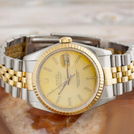 Two tone date just rolex front view on rock