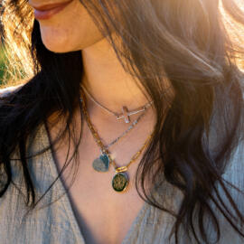 Layered chain example look with several necklaces being worn