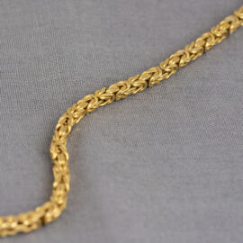 A yellow gold byzantine chain