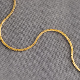 A yellow gold cobra chain