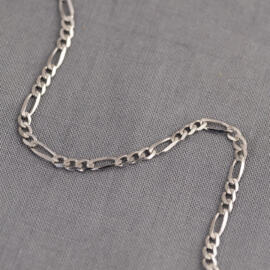A white gold figaro chain