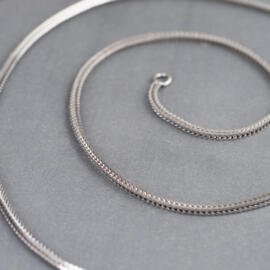 A white gold foxtail chain