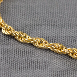 A close up shot of a yellow gold rope chain