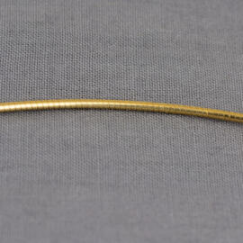 A close up shot of a yellow gold snake chain