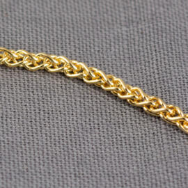 A close up shot of a yellow gold wheat chain