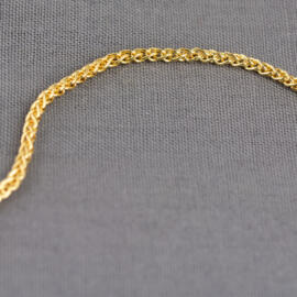 A yellow gold wheat chain