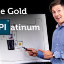 The text White Gold and Platinum is placed in front of a white board sketch of the periodic table of elements as Angelo the gemologist points to the elements