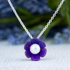 Purple lotus blossom necklace with anodized titanium and round white Akoya pearl with sterling silver chain - front view