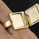 Hidden compartment letter U signet ring in 18k yellow gold fully open view