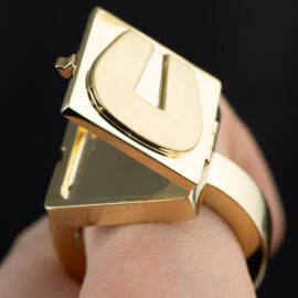 Hidden compartment letter U signet ring in 18k yellow gold partially open view