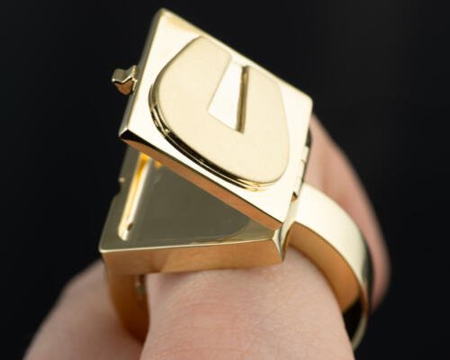Hidden compartment letter U signet ring in 18k yellow gold partially open view