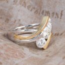 Custom three stone two tone engagement ring side view