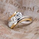 Custom three stone two tone engagement ring angled view