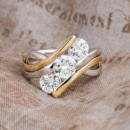 Custom three stone two tone engagement ring front view